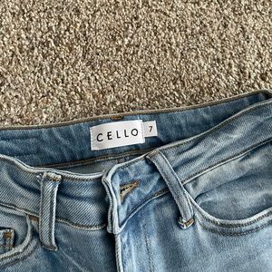 Cello size 7 distressed stretchy mid rise jeans.